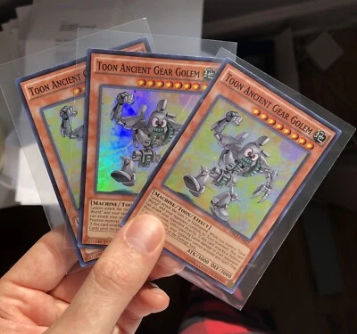 3x YuGiOh! TCG Toon Ancient Gear Golem DRL2-EN022 1st Edition Super Rare NM Holo - Image 1 of 3