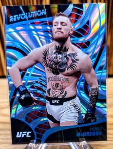 2023 UFC Conor McGregor Panini Chronicles Revolution #2 Sunburst 90/99 Blue