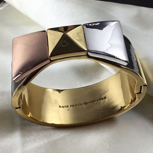 Bracciale Kate Spade NY tono oro metallo smalto nero tricolore fiocco