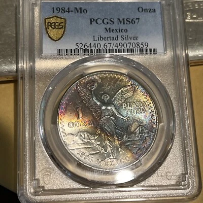 1984 Mexico 1 Onza Silver Libertad PCGS MS67 Monster Crescent Toning 🌈 Vivid! - Image 1 of 4