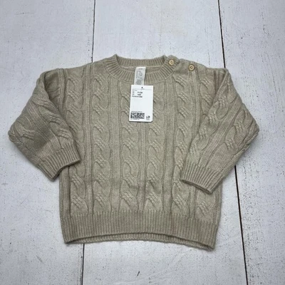 Suéter H&M Bebé 12 Meses Beige Tejido con Cable Cuello Redondo Botón Hombro Manga Larga Foto 1 de 4
