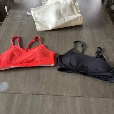 2 New Balance Womens Mediums Sports Bra Fitted One Orange and One Black EUC - Image 1 of 4