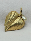 locket with faux pearl Avon solid perfume leaf