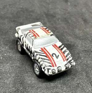 Micro Machines Mazda anni 80 RX-7 #2 Zebra dalla collezione #16 Rally Racers, Galoob - Foto 1 di 6