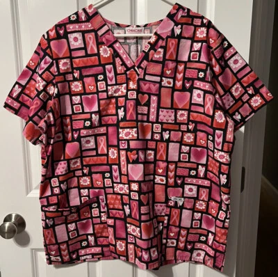 WOMENS SIZE LARGE CHEROKEE SCRUB TOP. PINK BREAST CANCER RIBBON PRINT - Image 1 of 4