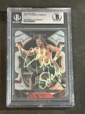 JAKE THE SNAKE ROBERTS 2023 PANINI SELECT WWE SILVER DIE-CUT PRIZM AUTO CARD BAS - Image 1 of 2