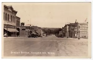 HENDERSON MINNESOTA STRASSENSZENE RPPC POSTKARTE 1938 BIER ÖL SCHILDER - Bild 1 von 2