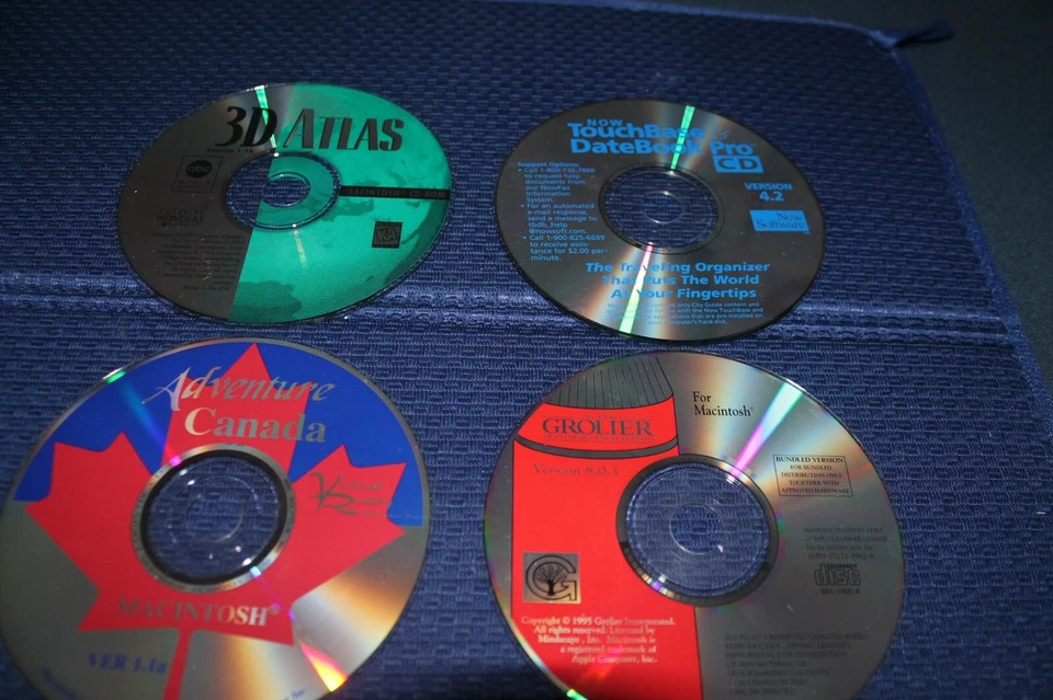 Apple CD-ROM Lot #2 3D Atlas/Grolier Encyclopedia/Adventure Canada/DateBook Pro - Image 1 of 1