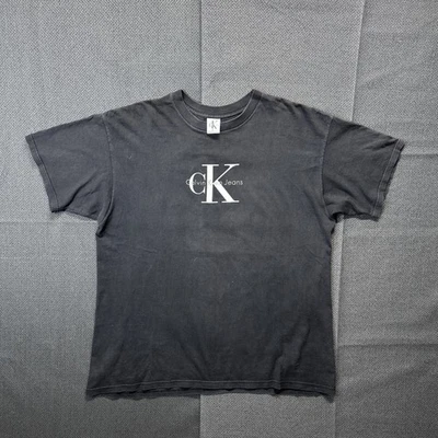 Vintage Calvin Klein Jeans Spell Out Logo T Shirt Size XL Black USA Made - Image 1 of 4