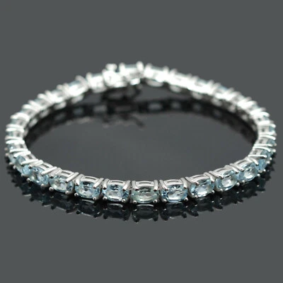 Brazalete de tenis de plata de ley 925 con piedras preciosas de topacio azul cielo natural de 6x4 mm Foto 1 de 4