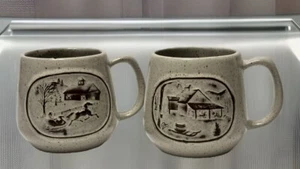 2 Onion River Pottery Coffee Mugs Cups Christmas Sleigh Barn Farm Snow Winter - Picture 1 of 6