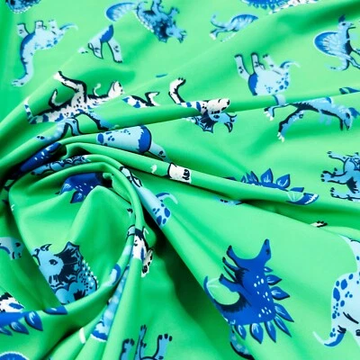 Tela de spandex de nailon con estampado de fondo verde de dinosaurios genéricos 4 vías elástica Foto 1 de 4