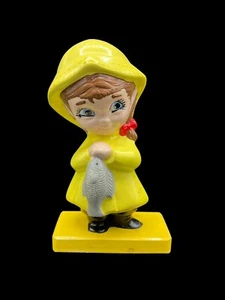 Vintage Handpainted Pottery of Girl in Rain Coat Holding a Fish - Picture 1 of 8