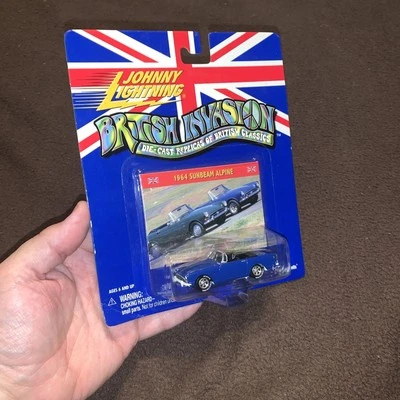 WHITE LIGHTNING 1964 SUNBEAM ALPINE     JOHNNY LIGHTNING BRITISH INVASION   1:64 - Image 1 of 4