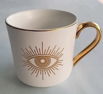 Mal de ojo, ojo sagrado, blanco con oro, café, taza de té Foto 1 de 4