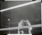 Carmen Basilio connects with a left to Tony DeMarco's head in  - 1955 Old Photo