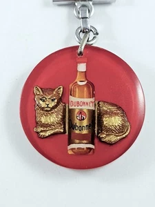 PORTE-CLES - Bourbon - VINS DUBONNET - Mr. MAROUF Betonlogo - Vintage 1960s - - Imagen 1 de 4