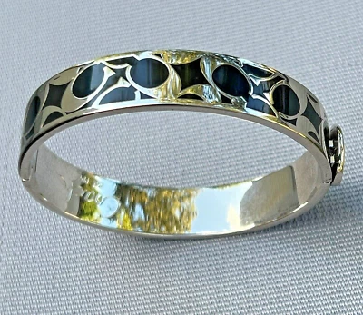 Brazalete Auténtico COACH Bisagras Esmalte Negro 6 cm. Diam. Tono plateado Foto 1 de 4