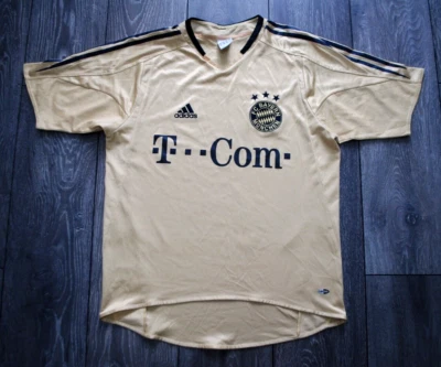 CAMISETA DE FUTBOL BAYERN MUNICH ALEMANIA VISITANTE 2004 2005 CAMISETA DORADA PEQUEÑA HOMBRE Foto 1 de 4