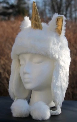 Niñas Unicornio Sombrero JUSTICIA Imitación Piel Blanco Dorado Caballo Poni Invierno Trampero  Foto 1 de 4