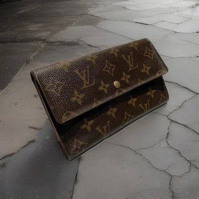 Cartera sin asas larga continental de lona con monograma Louis Vuitton Porte Tresor LV de colección Foto 1 de 4