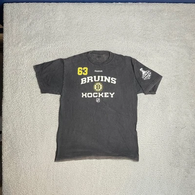 Boston Bruins NHL De Colección Gris Reebok Brad Marchand Camisa Envejecida Para Hombres M Foto 1 de 4
