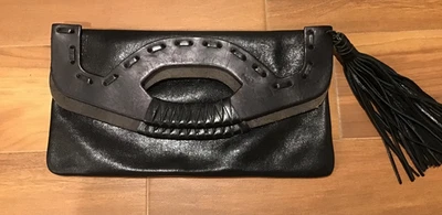 Cartera de mano sobre Cynthia Vincent Foto 1 de 4