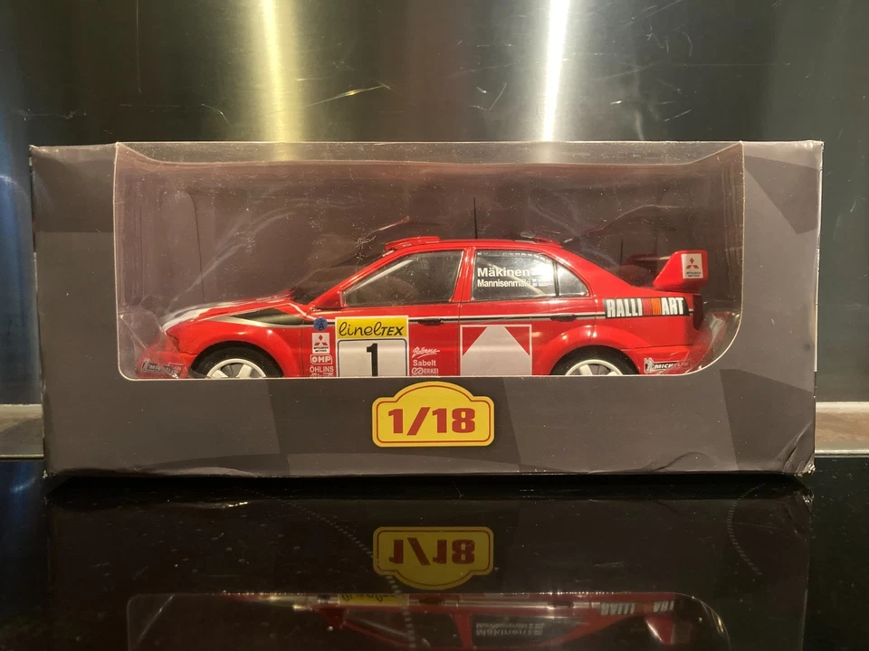 MITSUBISHI LANCER EVO VI RALLYE MONTE CARLO 1999 MAKINEN 1/18 ALTAYA IXO - Photo 1/4