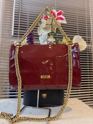 BOLSO MONEDERO HALSTON HERITAGE CHAROL ROJO (700 Foto 1 de 4