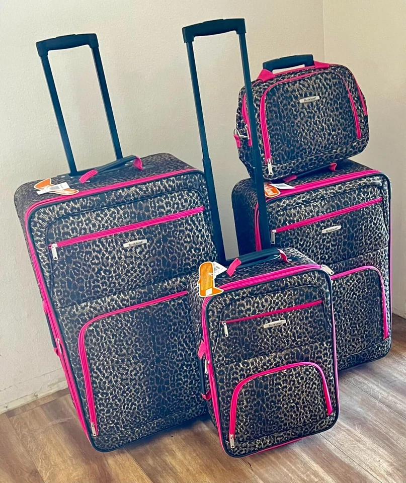 Rockland 4 Piece Luggage Set Softside Expandable 14" 29" 24" 28" Pink Leopard - Image 1 of 4