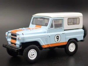 Modello Auto Diecast 1:64 NISSAN PATROL SUV TRUCK GULF RACING Blu 1960-1980 - Foto 1 di 7