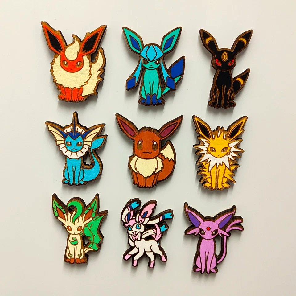 Imán Pokémon Eevee Evoluciones de Madera, Fan Jugador Nerd, Regalo Anime Geek Personalizado Foto 1 de 1