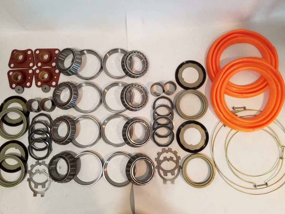 KIT BUJE/NUDILLOS ROCKWELL M35A2 MILITAR 2,5 TONELADAS DIRECCIÓN Y EJE TRASERO BOTAS NARANJAS Foto 1 de 1