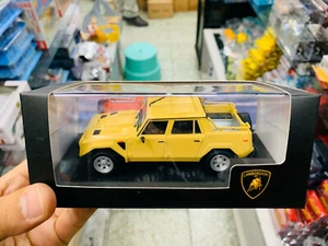 Coche modelo fundido a presión Lamborghini LM 002 1986 amarillo escala 1:43 nuevo en caja - Imagen 1 de 2