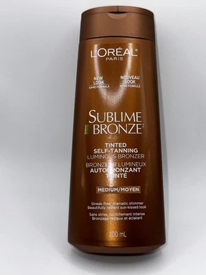 Loción bronceadora autobronceadora L'Oréal Paris Sublime bronceadora mediana luminosa 6,7 oz Foto 1 de 2