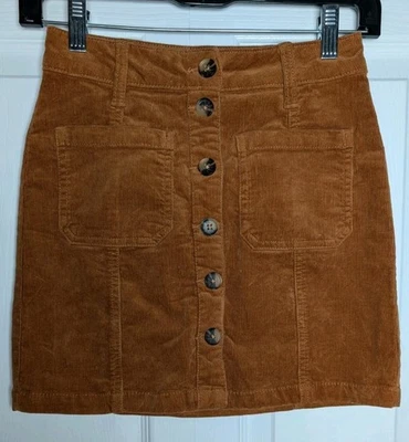 Minifalda delantera con botones de pana So Rust talla 0/24 bolsillos delanteros Foto 1 de 4