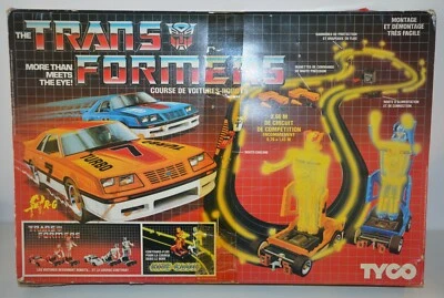 CIRCUIT Course de Voitures ROBOT TRANSFORMERS TYCO vintage 80's 1985 - Photo 1/4