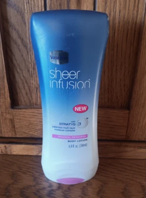 Loción corporal con infusión transparente de vaselina renovación mineral 6,8 fl oz 200 ml Foto 1 de 2