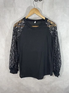 Waffelstrickbluse mit Häkelärmeln - Bild 1 von 16
