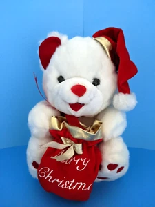 MB Peluche Internacional 11" Oso de Navidad con Sombrero de Santa y Bolsa de Regalo Feliz Navidad - Imagen 1 de 7