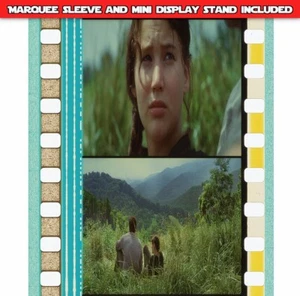 Hunger Games (2012) - Katniss entspannt mit Sturm - 35mm 5 Zellen Filmstreifen 728 - Bild 1 von 3