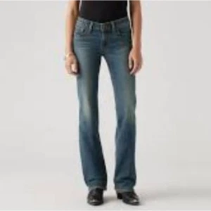 Pantalones de mezclilla elásticos de tiro medio con hilo universal de colección talla 0/25 nuevos con etiquetas - Imagen 1 de 4