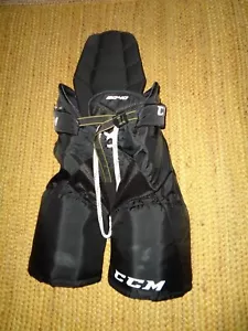 PANTALONES ACOLCHADOS DE HOCKEY SOBRE HIELO CCM SENIOR 19F NEGROS - TALLA PEQUEÑA - Imagen 1 de 3