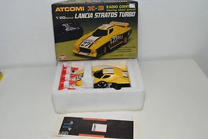 RADIOCOMANDO ATCOMI ASAHI HONG KONG X-3 R/C LANCIA STRATOS TURBO NUOVO CON SC... - Foto 1 di 1