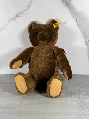Etiqueta de botón de oreja de oso de peluche marrón Steiff vintage Foto 1 de 4