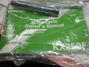 2009 Kawasaki KX250F Owner's manual with spoke wrench and spark plug wrench - Picture 1 of 1