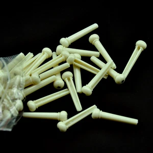 Lote de 50 pasadores de puente para guitarra acústica de plástico blanco con punto negro - Imagen 1 de 4