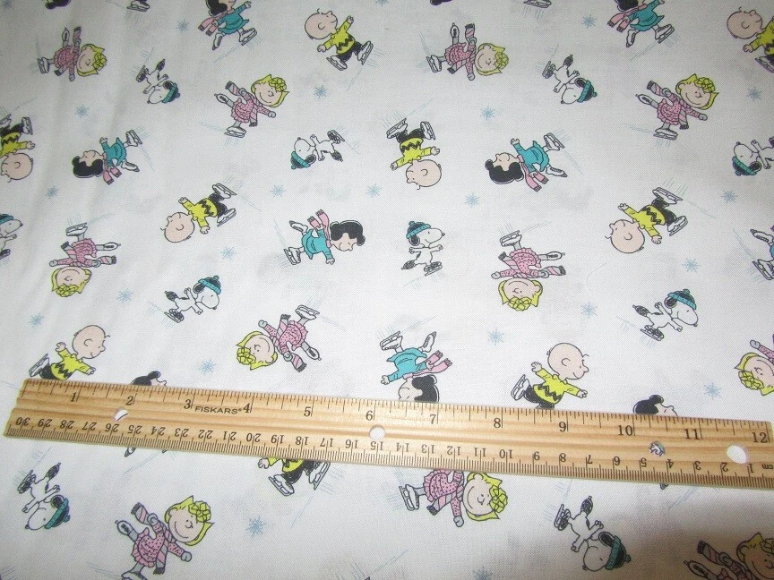 White Peanuts Gang Character Winter Skating Cotton Fabric by the Yard - Image 1 of 1