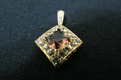 Colgante Nolan Miller. Nuevo. Piedra principal color bronce rodeada de cristales. Foto 1 de 4