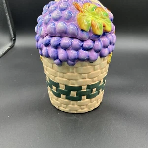 Alco Industries Cookie Jar Canister Grapes & Leaves in Tan Weaved Basket, 8 1/2” - Picture 1 of 6